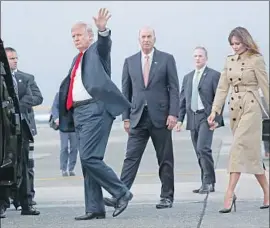  ?? Pablo Martinez Monsivais Associated Press ?? THE PRESIDENT and first lady arrive in Brussels for the alliance’s summit. “NATO is not a protection racket,” one expert says of Trump’s claims.