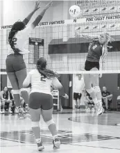  ?? D.A. VARELA dvarela@miamiheral­d.com ?? Cardinal Gibbons middle blocker Teyhlor Thomas jumps to block a shot by a Pine Crest middle blocker during the regional semifinal playoff volleyball match Thursday.