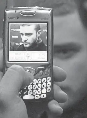  ?? THE COMMERCIAL APPEAL FILES ?? Jan. 24, 2007: A member of the media takes Justin Timberlake’s picture before the premiere of “Black Snake Moan” at Sundance Film Festival.