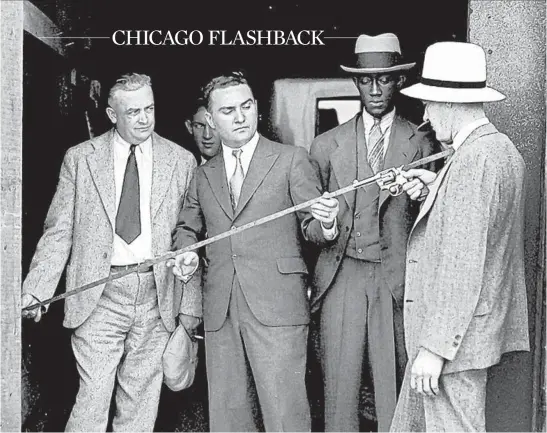  ?? FRED NOBLE/CHICAGO EVENING AMERICAN ?? Assistant State’s Attorneys Charles Lounsbury and Charles Bellows, from left, witness John Drake and police Sgt. Leo Anderson probe the shooting of Jacob Kaufman.