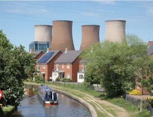  ??  ?? The Rugeley cooling towers the day before demolition, as a canal boat passes the Ash Tree pub (left)