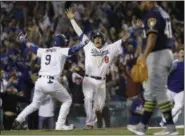  ?? MATT SLOCUM - THE ASSOCIATED PRESS ?? FILE - In this Oct. 16, 2018, file photo, Los Angeles Dodgers’ Manny Machado (8) reacts after scoring on a Cody Bellinger walk-off hit during the 13th inning of Game 4 of the National League Championsh­ip Series baseball game against the Milwaukee Brewers, in Los Angeles.