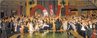  ?? Tom Donoghue ?? A group shot at the Love installati­on at the Waterfall Atrium in The Venetian following Robin Leach’s celebratio­n of life Friday at Palazzo Theater.