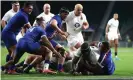  ??  ?? Maro Itoje of England scores their winning try despite being held by Cameron Woki. Photograph: David Rogers/