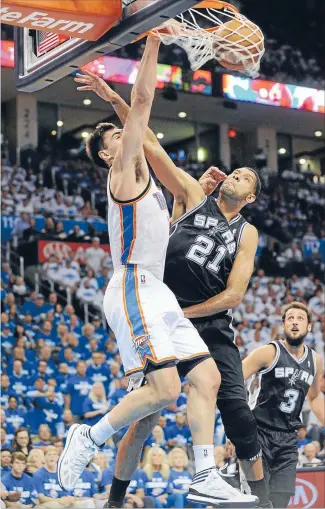  ?? Photo: USA TODAY SPORTS ?? Dunkin’ on Duncan: Thunder rookie Steven Adams finishes over the top of Spurs legend Tim Duncan during yesterday’s playoff win.