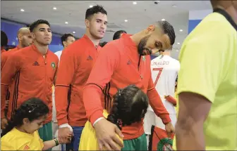  ??  ?? Mehdi Benatia of Morocco speaking with his mascot in the tunnel prior to the Group B match between Portugal and Morocco at Luzhniki Stadium, Moscow