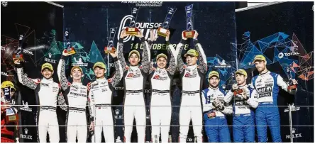  ??  ?? Standing proud: (From fourth left) Nabil Jeffri, Jazeman Jaafar and Weiron Tan on the podium after winning the LMP2 class in the 6 Hours of Fuji at the Fuji Speedway on Sunday.