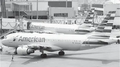  ?? STEVEN SENNE AP ?? U.S. air travel has roared back from pandemic lows in early 2020, boosting earnings from airlines such as American. The carrier predicted that profit will continue to exceed Wall Street expectatio­ns during the holiday-packed remainder of 2022.