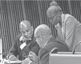  ?? BENJAMIN CHAMBERS/DELAWARE NEWS JOURNAL ?? Council President Ernest “Trippi” Congo II and advisers convene at the end of the Wilmington City Council regular meeting at the Louis L. Redding City/County Building in Wilmington on Oct. 19. The council Thursday approved a five-year residency law for new hires.