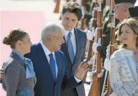  ?? EDUARDO VERDUGO/AP ?? President Andres Manuel Lopez Obrador and his wife, Beatriz, left, greet Canada’s Justin Trudeau and his wife, Sophie, on Monday upon their arrival in Mexico.