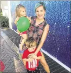  ?? CONTRIBUTE­D ?? Artist and recovering addict Christy Lebiedzins­ki is raising her children Lacey (left) and Lyric in Delray Beach, and painting a beachtheme­d mural outside Living Right, a sober home on North B Street in Lake Worth.