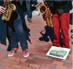  ?? DAVID L. RYAN/GLOBE STAFF ?? Demonstrat­ors outside of the State House, April 11, 2019.