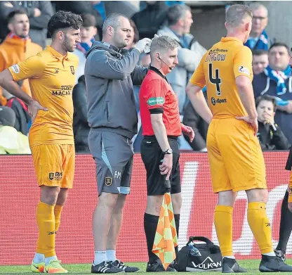  ?? Picture: Getty. ?? Calum Spence receives treatment after the incident at the Tony Macaroni Arena.