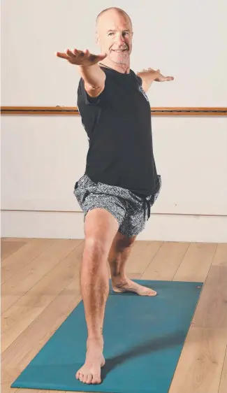  ?? FLEXIBLE ATTITUDE: Townsville instructor Michael Blades is encouragin­g men to try yoga with a males- only course which starts today. Picture: ZAK SIMMONDS ??