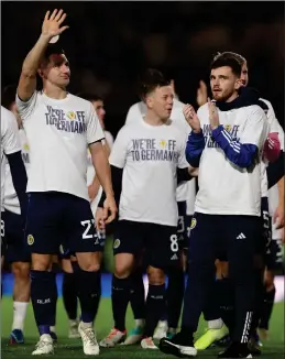  ?? ?? Nathan Patterson jumps for joy after Scotland’s third goal (main) on a night where the country celebrated progressio­n to Euro 2024 (above) and manager Steve Clarke’s revolution (left)