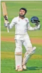  ??  ?? Hardik Tamore of Mumbai after scoring a century