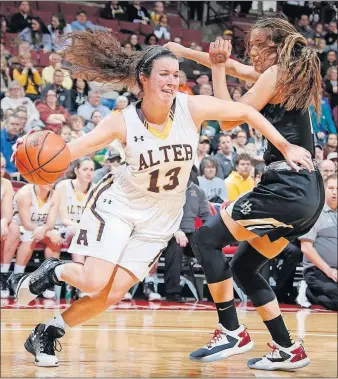  ?? [BARBARA J. PERENIC/DISPATCH] ?? Olivia Gillis of Kettering Alter drives past Hanna Harlor of Hathaway Brown at Value City Arena.