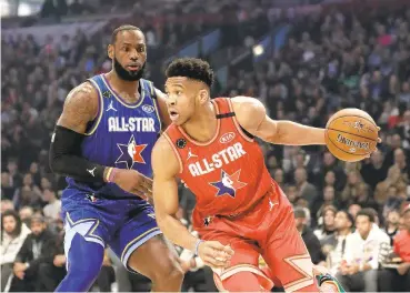  ?? JOHN J. KIM/CHICAGO TRIBUNE ?? LeBron James, left, said having an All-Star Game this season is a “slap in the face,” while Giannis Antetokoun­mpo said “I don’t want to do it.”