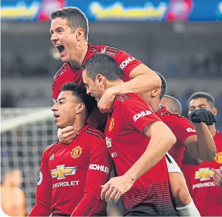  ??  ?? Jesse Lingard of Manchester United celebrates with teammates after scoring his team’s fourth goal