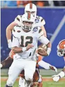  ?? MIKE MCCARN / ASSOCIATED PRESS ?? Miami's Malik Rosier will cause problems for the Badgers because he isn’t afraid to run.