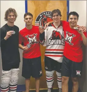  ?? SUBMITTED PHOTO DENNIS WEBBER ?? Missoula Junior Bruins Mason Mowat (centre-left), of Brooks, and Kieran Christians­on (centrerigh­t) of Medicine Hat stand celebrate their first NA3HL goals with teammates Owen Miley (left) and Liam Bland.