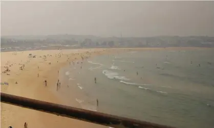  ?? Photograph: Steven Saphore/AAP ?? Climate change remains a pressing issue for voters in the federal electorate of Wentworth which includes Bondi Beach – seen here in 2019, covered by smoke haze from bushfires in New South Wales.