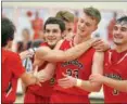  ?? PAUL DICICCO — THE NEWS-HERALD ?? Chardon’s Alex Sulka is congratula­ted after becoming the Hilltopper­s’ alltime leading scorer on Jan. 13. Sulka finished with 25 points.