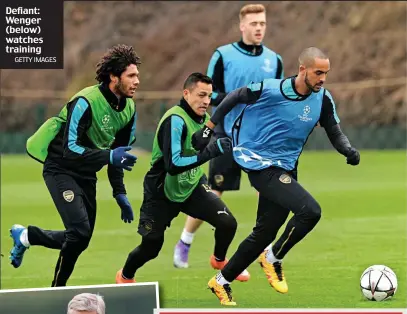  ?? GETTY IMAGES ?? Defiant: Wenger (below) watches training