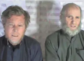  ?? EPA-EFE ?? This screen grab of video released on Jan. 11, 2017, by the Taliban shows Australian Timothy Weeks, left, and American Kevin King.