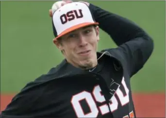  ?? THE ASSOCIATED PRESS ?? Oregon State pitcher Luke Heimlich, who as a teenager pleaded guilty to molesting a 6-year-old girl, will not accompany the Beavers to the College World Series.