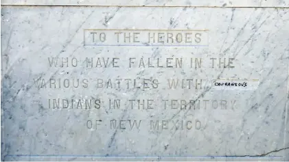  ?? LUIS SÁNCHEZ SATURNO/NEW MEXICAN FILE PHOTOS ?? The obelisk in the center of the Plaza originally included an inscriptio­n that read, ‘To the heroes who have fallen in various battles with savage Indians in the Territory of New Mexico.’ The word ‘savage’ was chipped out by an unidentifi­ed man in 1974. Last year, someone wrote the word ‘courageous’ in the chipped-out space.