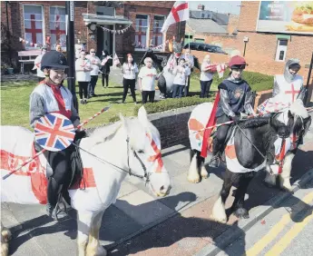  ??  ?? The Park Trust head off through Pallion to mark St George’s Day.