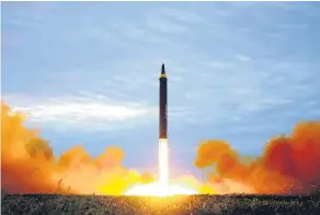  ?? Picture / AP ?? North Korea yesterday released images of Tuesday’s launch of a Hwasong-12 intermedia­te-range ballistic missile.