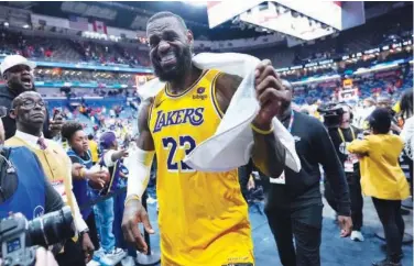  ?? File / Associated Press ?? ↑
Lebron James (23) smiles as he leaves the court after an NBA basketball playin tournament game against the New Orleans Pelicans in New Orleans.