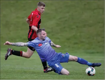  ??  ?? Declan Downes of North End United slides in to win the ball during North End’s recent FAI Cup win over Cherry Orchard.