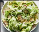  ?? DAVID MALOSH — THE NEW YORK TIMES ?? Inspired by a salad at a Puerto Rican diner in New York, this dish is substantia­l with avocados but the lemony dressing, radishes and iceberg lettuce keep it light.