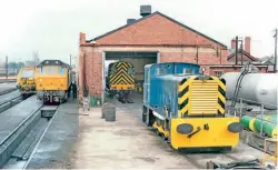  ?? Gordon Edgar ?? PWM650 has just received a full overhaul and repaint into BR blue in the workshop at Gloucester Horton Road depot on July 28, 1979. Inside the workshop is 08826, while 25216 stands alongside. The locomotive is now owned by the Heritage Shunters Trust and restoratio­n work on it is being carried out at its Rowsley South base.