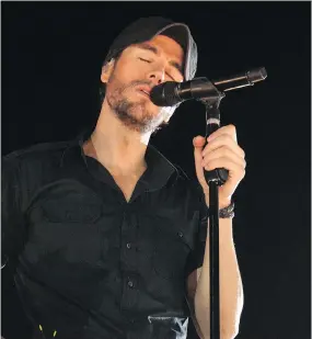  ?? ARIEL SCHALIT/THE ASSOCIATED PRESS ?? Enrique Iglesias says performing for his fans comes second only to the love he has for his family — wife Anna and their newborn twins.
