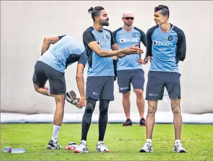  ?? AFP ?? After paceman Mohammed Siraj (left) got his Test cap at the MCG, Navdeep Saini (right) is set to make his debut at Sydney on Thursday.