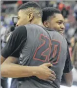  ?? MARC PENDLETON / STAFF ?? Wayne’s Xeyrius Williams (left) celebrates with Trey Landers after defeating Westervill­e South in the championsh­ip game Saturday. Williams, a 6-8 senior that will play for the University of Dayton next season, finished the game with 12 points and six...