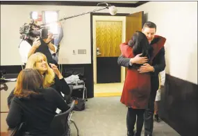  ?? Christian Abraham / Hearst Connecticu­t Media ?? Kidney recipient Angelinne Linares, of Norwalk, is hugged by her donor, Matthew Budzik, at an arranged meeting between donors and recipients at Yale Physicians Building in New Haven on Tuesday. Angelinne's sister Jasmine, back to camera at left,...