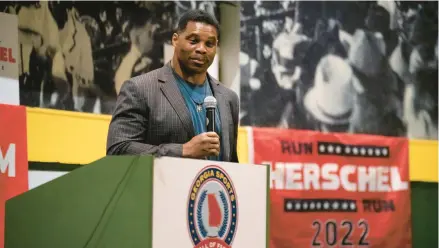  ?? NICOLE CRAINE/THE NEW YORK TIMES ?? Republican U.S. Senate candidate Herschel Walker campaigns last week at the Georgia Sports Hall of Fame in Macon.