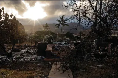  ?? (The New York Times/Bryan Anselm) ?? The rubble of a home in Lahaina following fires on the Hawaiian island of Maui is seen Aug. 16. The front steps were all that remained of some homes on the island.