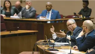  ?? ANTONIO PEREZ/CHICAGO TRIBUNE ?? CTA President Dorval Carter Jr., second from right, speaks before aldermen at City Hall on Feb. 27 during a quarterly hearing on CTA services, with committee Vice Chair Ald. Andre Vasquez at right. Carter was grilled over CTA service, safety and crime.