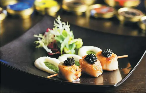  ?? PROVIDED TO CHINA DAILY ?? Pan-fried scallops topped with caviar from the Ritz Carlton Pudong hotel in Shanghai, one of the largest hospitalit­y clients of Kaluga Queen in China.