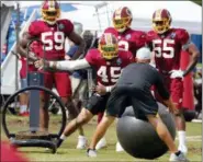  ?? STEVE HELBER — THE ASSOCIATED PRESS ?? Washington Redskins linebacker Pete Robertson (45) runs a drill during the morning session at NFL football training camp in Richmond, Va., Thursday, Aug. 2, 2018.