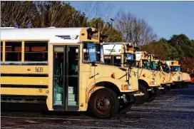  ?? AJC FILE ?? Georgia schools have a difficult time filling school bus driver positions, in part because pay is not competitiv­e with other driving jobs. Rural Georgia counties, which have been hardest hit, are looking for alternativ­e solutions.