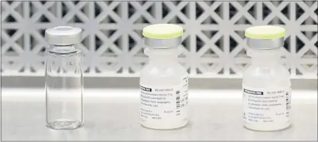  ?? TED S. WARREN — THE ASSOCIATED PRESS ?? Vials used by pharmacist­s to prepare syringes were used in Seattle on March 16, the first day of a clinical trial of a potential vaccine for COVID-19.