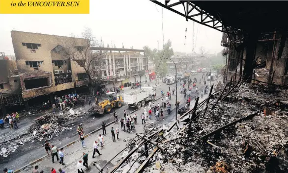  ?? HADI MIZBAN / THE ASSOCIATED PRESS ?? The car bombing struck Baghdad’s Karrada neighbourh­ood, a busy shopping district where families lined the streets early Sunday. At least 121 were killed and hundreds injured.
