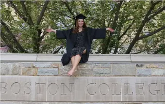  ?? NANcy LANE / HERALd sTAFF ?? SCHOOL BREAK: Boston College grad Amanda L’Esperance poses for a family photo at the Heights on what would have been commenceme­nt day. BC plans to open its campus in the fall.